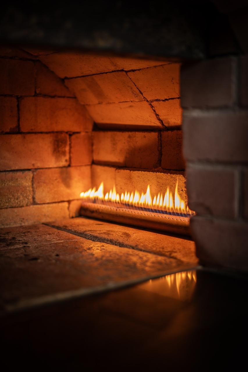 Fire glowing inside the SOYL kitchen oven
